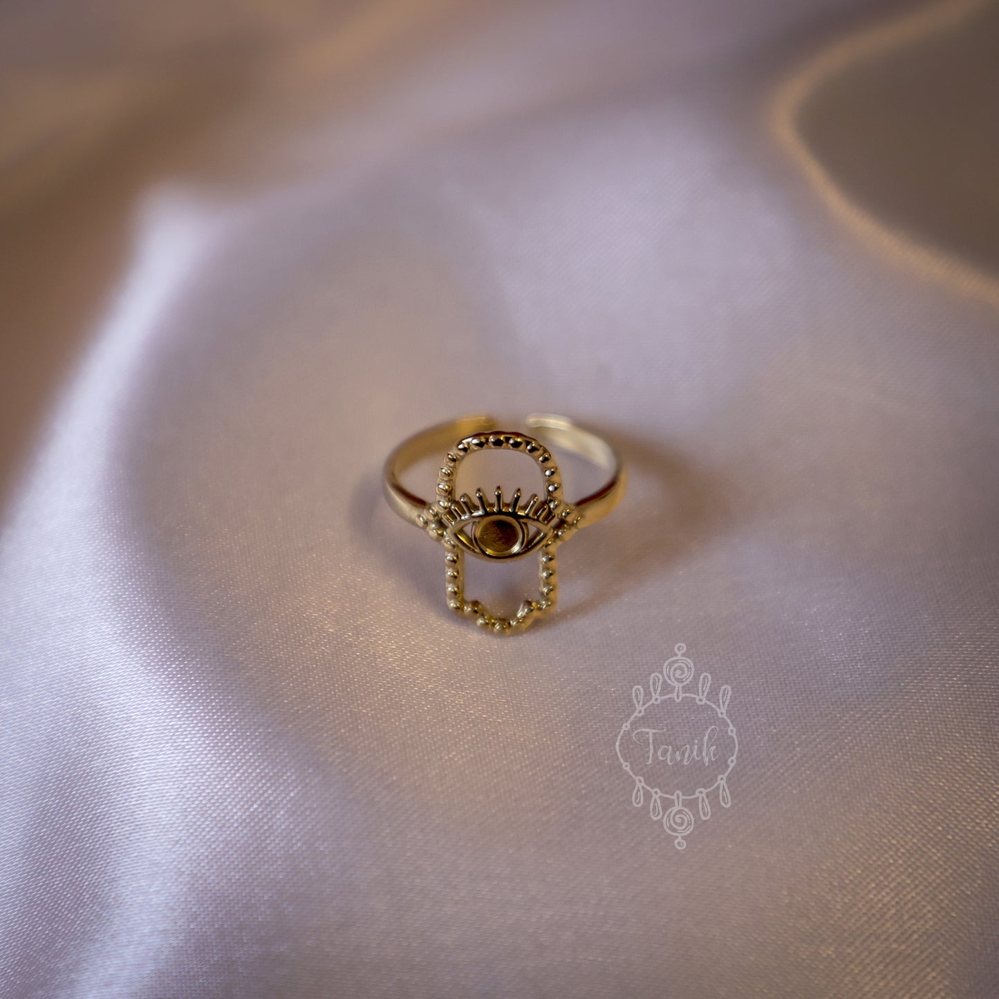 Adjustable ring with evil eye design